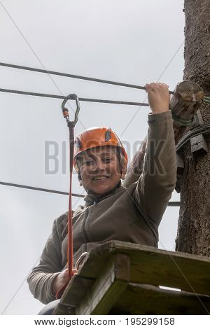 Happy Romanian Tourist Woman On Course In Retezat Mountains Helmet And Safety Equipment
