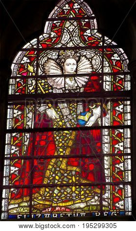 LONDON, ENGLAND - JANUARY 16, 2017 Queen Elizabeth 1 Stained Glass 13th Century Chapter House Westminster Abbey Church London England. Westminister Abbey has been the burial place of Britain's monarchs including Elizabeth 1 since the 11th century and is t