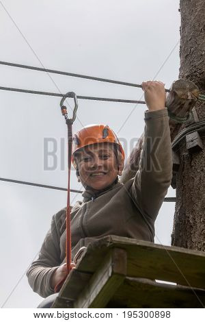 Happy Romanian Tourist Woman On Course In Retezat Mountains Helmet And Safety Equipment