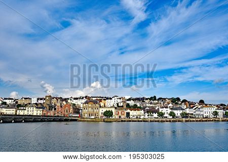 Bideford North Devon England 13th July 2017 - The quay and old bridge in the port of Bideford in North Devon England taken from Wooda Wharf looking west acfross the river Torridge