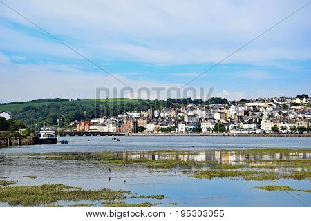 Bideford North Devon England 13th July 2017 - The quay and old bridge in the port of Bideford in North Devon England taken from the Tarka Trail looking west across the river Torridge