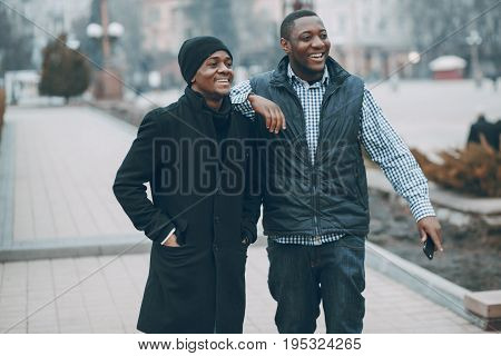 handsome men in autumn city with phone