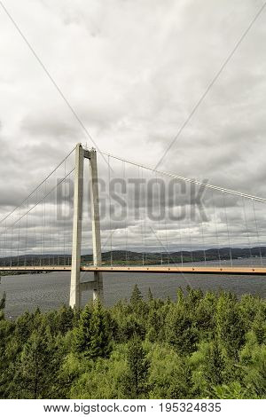 The High Coast Bride in Sweden with a cloudy sky.