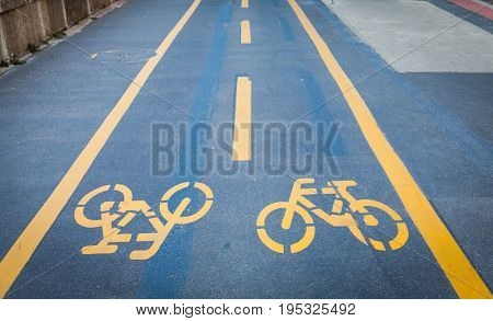 Bicycle Signs Painted On Asphalt