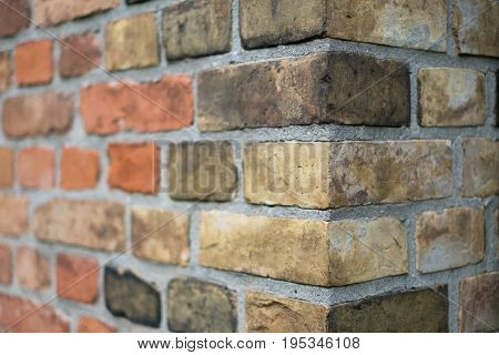 Corner of a vintage brick wall - stone brick wall edge