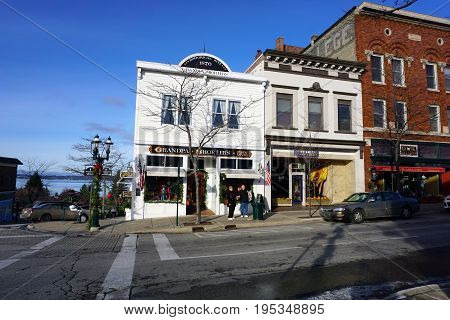 PETOSKEY, MICHIGAN / UNITED STATES - NOVEMBER 22, 2016: One may purchase gifts at Grandpa Shorter's Gift Shop, and shoes at Robert Frost Fine Footwear, on Lake Street in downtown Petoskey.