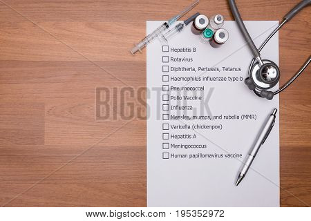 Doctor are checking his patient's Vaccination schedule.