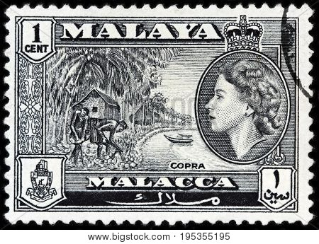 LUGA RUSSIA - APRIL 26 2017: A stamp printed by MALAYA shows image portrait of Queen Elizabeth II against beautiful landscape of peninsula in Southeast Asia circa 1957.