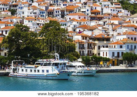SKOPELOS, GREECE - JUNE 14, 2017: View of the harbour in Skopelos town, Greece on June 14, 2017.