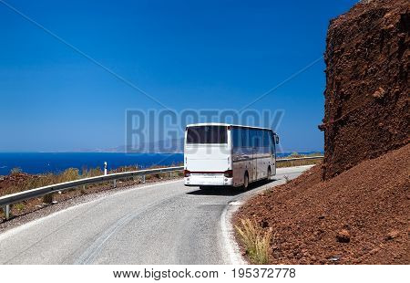 Greece Santorini the rise of bus on a winding road