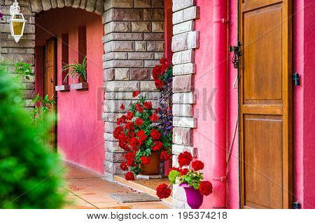 Village House Entrance Decorated By Flowers