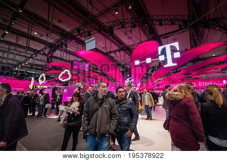 HANNOVER GERMANY - MARCH 14 2016: Booth of Deutsche Telekom company at CeBIT information technology trade show in Hannover Germany on March 14 2016.