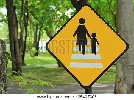 Traffic sign road on blur road in the park