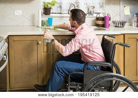 Disabled Man Cleaning His Kitchen