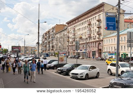 MOSCOW - JULY 5: Pedestrians and cars on Krasnaya Presnya street on July 5 2017 in Moscow. Krasnaya Presnya street is located in the center of Moscow.