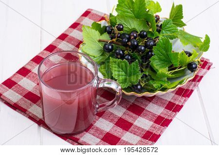 Useful vitamin fresh juice in glass on wooden table. Studio Photo