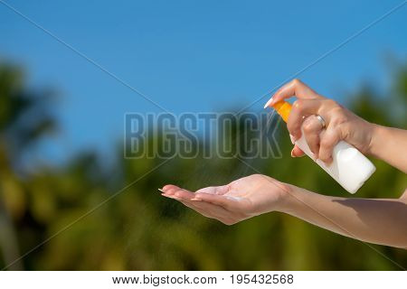 Woman Hands Putting Sunscreen From A Suncream Bottle
