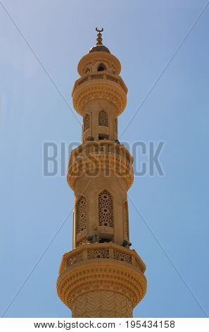 Mosque in Hurgada, Egypt behind blue sky
