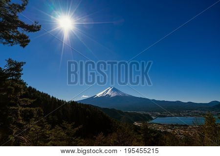 mountain fuji on day time and lake with sun light on blue sky - can use to display or montage on product