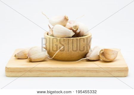 Fresh Garlic blub on wooden board on white background