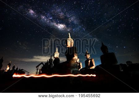 Background blur and sofe focus Milky Way and statues in the night sky dark vision blurred.In Thailand.