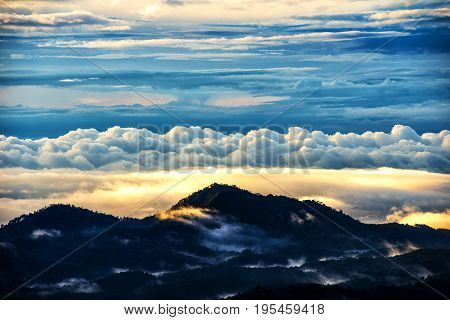Light morning with fog floating on the mountain and sky is a beautiful view. And is a popular tourist destination of the photographer to capture nature. The Doi Inthanon Chiang Mai Thailand.