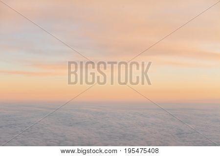 the sky above the clouds from aircraft iljuminatora at sunset