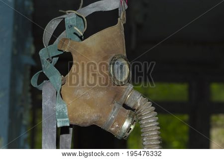 Gas Mask hanging in Abandoned Room in Ghost Town of Pripyat within Chernobyl Exclusion Zone