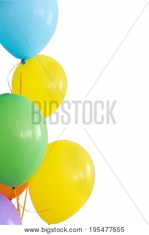 holiday, decorations for birthday, joy concept - brightly colored inflated balloons on ribbons, five colors, blue, yellow, green, orange, violet, copy space, vetical, isolated on white background.