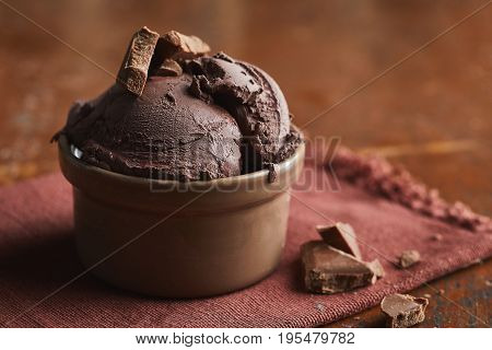 Close-up view of delicious chocolate homemade ice cream with pieces of choclate on top