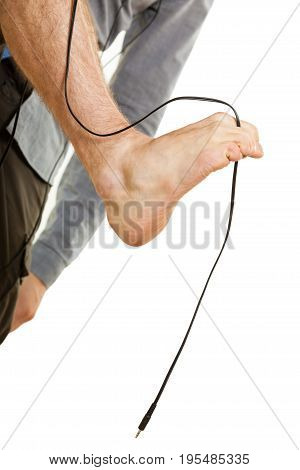Orthopaedist exercises feet rehabilitation concept. Man foot having cable between toes isolated.