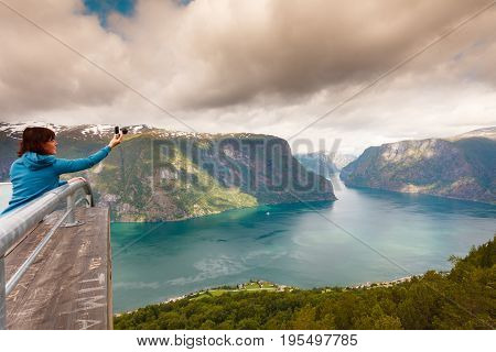 Tourist Taking Photo From Stegastein Viewpoint Norway