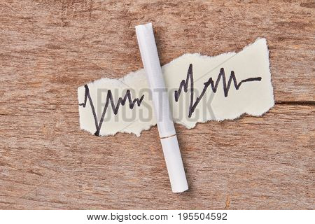 Tobacco cigarette, image of heart impulses. Smoking is harmful for heart and health.