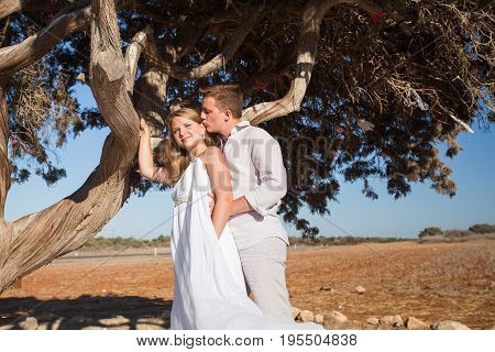 Romantic dating. Young loving couple embracing on nature.