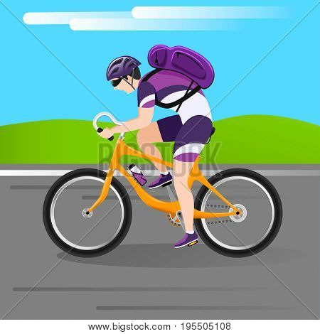 a young man traveling on his favorite bike in the countryside