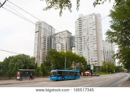 MOSCOW - JULY 13: Multi-story apartment houses and a trolley at Shmitovskaya Street on July 13 2017 in Moscow. Shmitovski Street is located in Central Administrative District of Moscow.