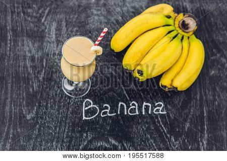 Banana Smoothies And Bananas On An Old Wooden Background