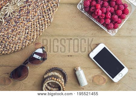 Summer Holiday, Vacation, Relaxation Concept. Raspberries, Straw Hat, Smartphone, Sunglasses From Ab