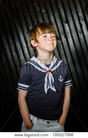 Schoolboy Posing In Sailor Costume With Emotions