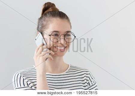 Side Portrait Of Young European Female Isolated On Gray Background Wearing Hipster Eyeglasses, Liste