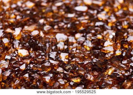 Brown Amber stones background. Close up of natural gems, jewels placer texture. Beauty, jewelry concept