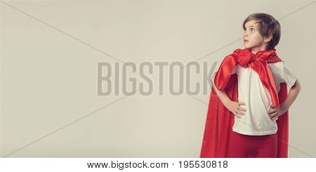 Female Superhero Kid Posing In Studio