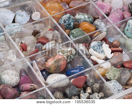 Box with natural colored gemstones. Mineral and gem collection