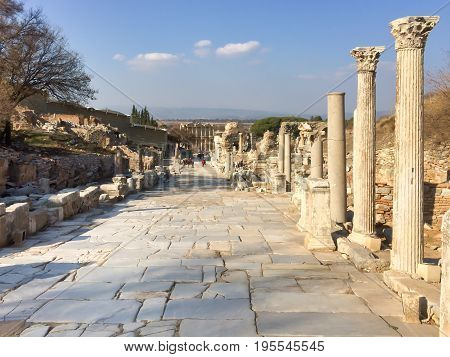 Roman Stone Pillars And Statue Ruins On Road Side In Ephesus Archaeological Site In Turkey