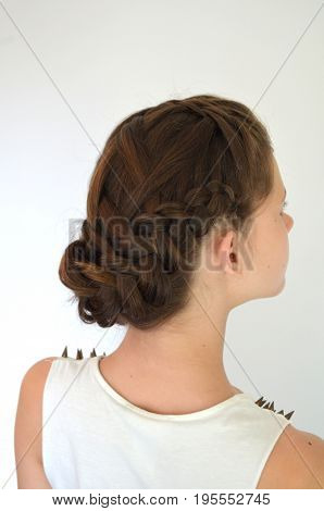 Hairstyle with long hair - young girl on a white background