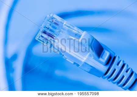 Local area network Ethernet Cable close up. Blue filter. Selective focus.