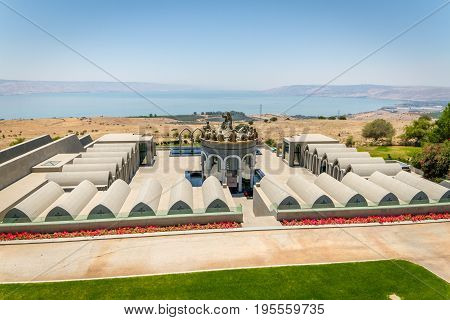 GALILEE ISRAEL - JUNE 24: The statues of Jesus and Twelve Apostles in Domus Galilaeae on the Mount of Beatitudes near the Sea of Galilee Israel on June 24 2017