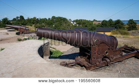 Two iron cannons installed on an fortress island next to Helsinki