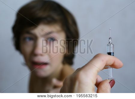 Teenager Boy Afraid Of Syringe Injection Vaccination