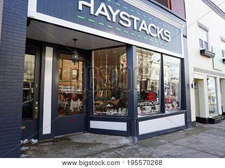PETOSKEY, MICHIGAN / UNITED STATES - NOVEMBER 22, 2016: One may purchase women's apparel, gifts, accessories, dresses, hats, earrings, jewelry, purses, sweaters, and skirts at Haystacks, on Lake Street in downtown Petoskey.